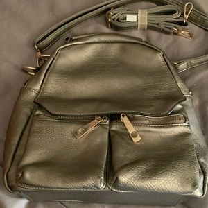 Metallic Backpack/Handbag no brand w/ lots of pockets inside n outside.